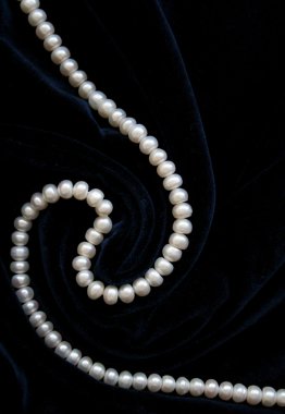 White pearls on the black velvet clipart