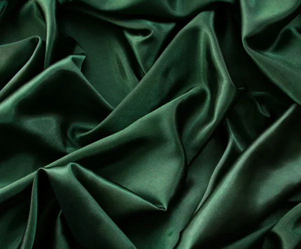 Гладкий элегантный темно-зеленый шелк — стоковое фото