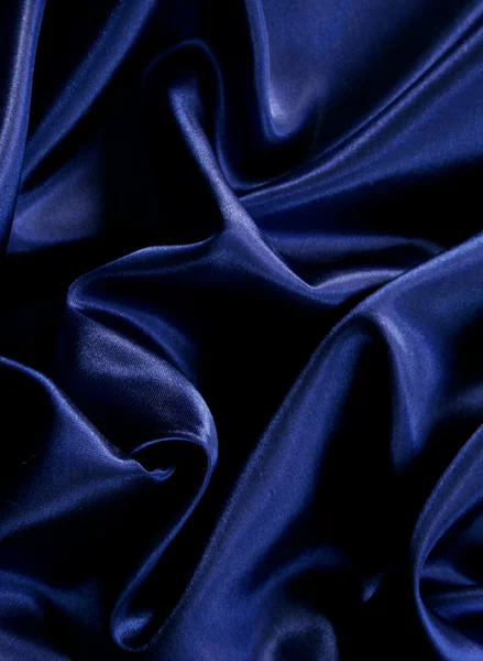 Ομαλή κομψό σκούρο μπλε μετάξι ως φόντο — Stockfoto
