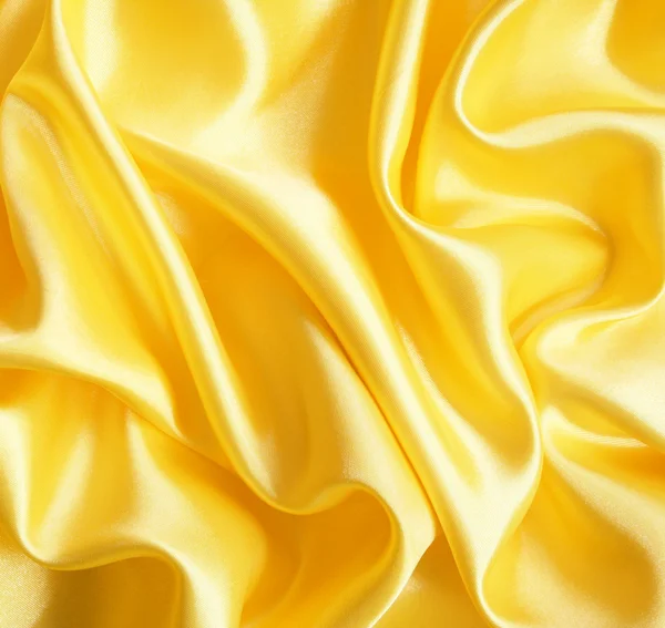 Liscio elegante seta dorata come sfondo — Foto Stock