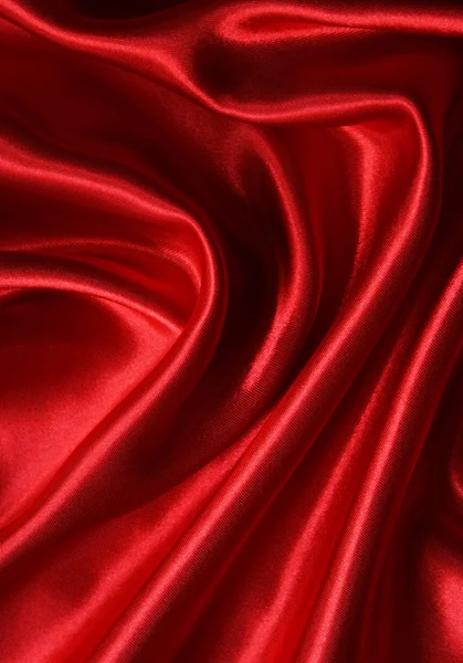 Hladké elegantní červeného hedvábí jako pozadí — Stock fotografie