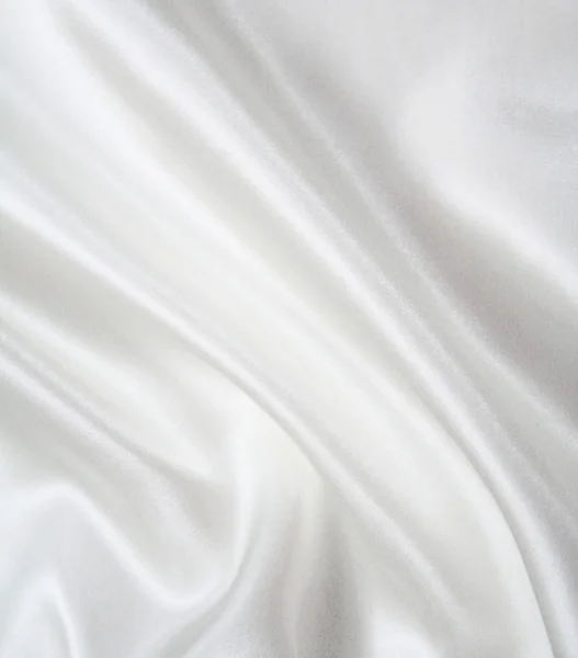 ผ้าไหมสีขาวเรียบหรูเป็นพื้นหลังงานแต่งงาน — ภาพถ่ายสต็อก