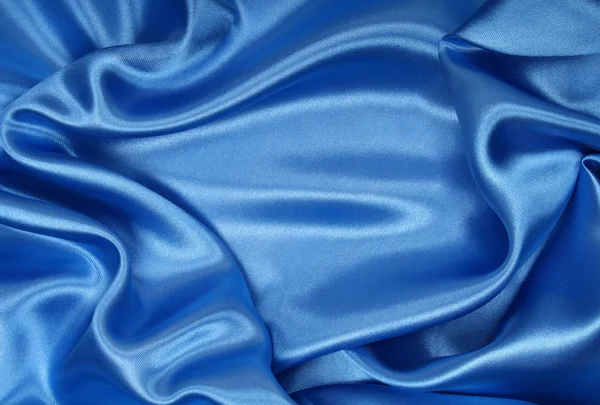 Hladké elegantní modré hedvábí jako pozadí — Stock fotografie