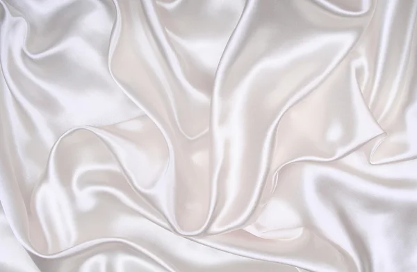 背景として滑らかなエレガントな白い絹 — ストック写真