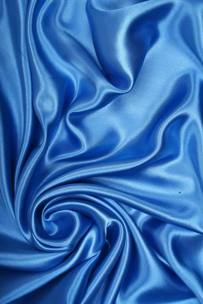 Sima, elegáns kék selyem háttereként — Stock Fotó
