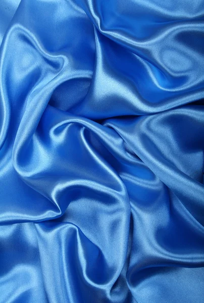 Soepele elegante blauwe zijde als achtergrond — Stockfoto