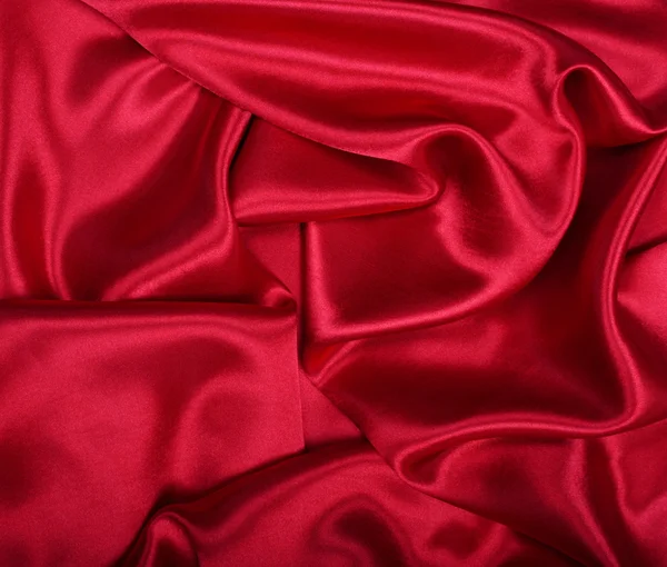 Hladké elegantní červené hedvábí může použít jako pozadí — Stock fotografie