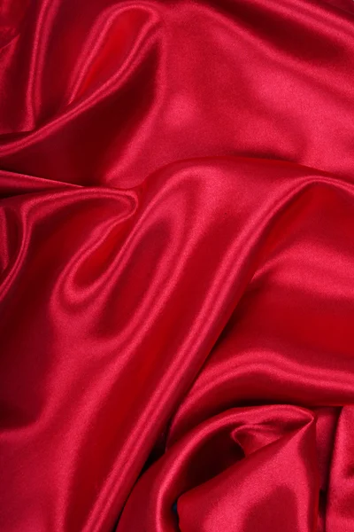 Гладкий елегантний червоний шовк може використовуватись як фон — стокове фото
