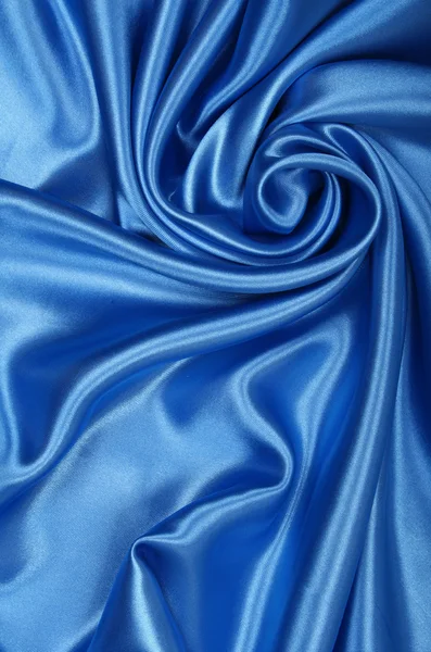 ผ้าไหมสีฟ้าหรูหราเรียบเป็นพื้นหลัง — ภาพถ่ายสต็อก