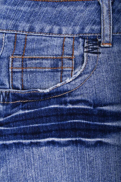 蓝色牛仔裤织物的口袋里作为背景 — 图库照片