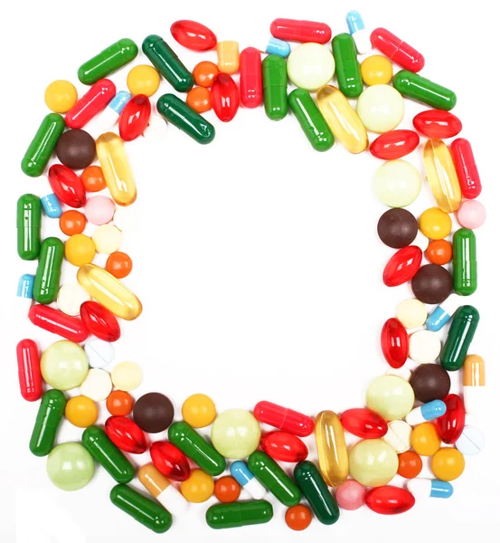 Várias pílulas e cápsulas multicoloridas — Fotografia de Stock
