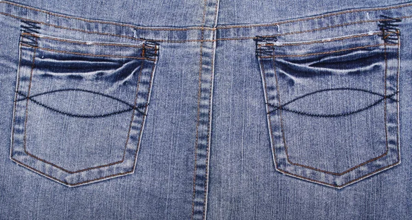 有口袋蓝色牛仔裤面料可以使用作为背景 — 图库照片