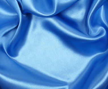 Smooth elegant blue silk as background clipart