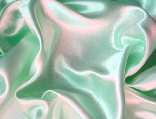 Hladké elegantní zelené hedvábí jako pozadí — Stock fotografie