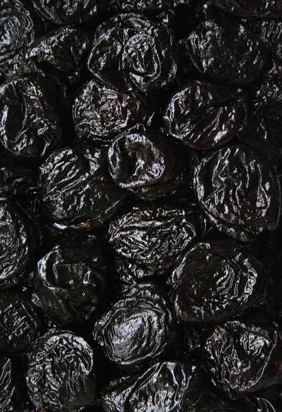 stock image Dry plums or prunes fruit as background