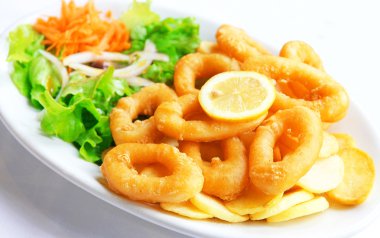 Deep batter fried squid rings calamari with green salad clipart