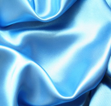 Smooth elegant blue silk as background clipart