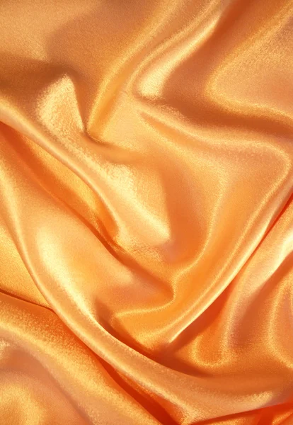 Ομαλή κομψό χρυσό σατινέ ως φόντο — Φωτογραφία Αρχείου