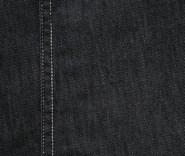 Black jeans fabric as background — Stock Photo, Image