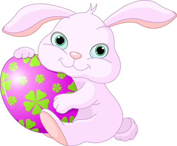 Conejo de Pascua tiene huevo — Vector de stock