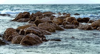 Stone coast Mediterranean sea in Caesarea, Israel clipart