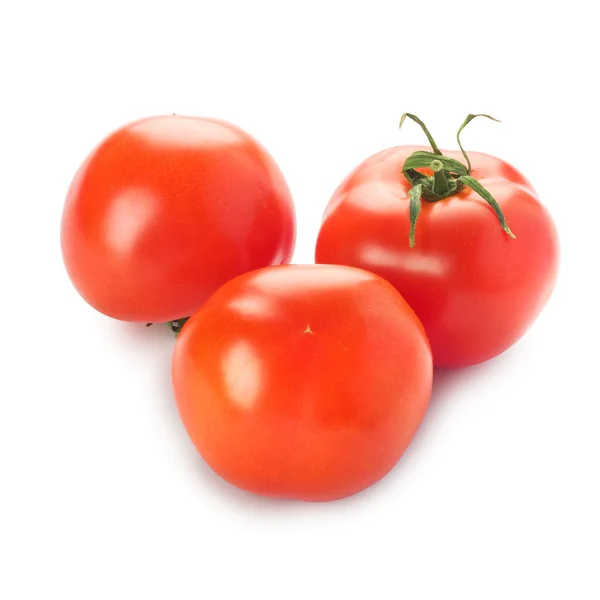 Drei Tomaten mit grünem Zweig auf weißem Grund — Stockfoto