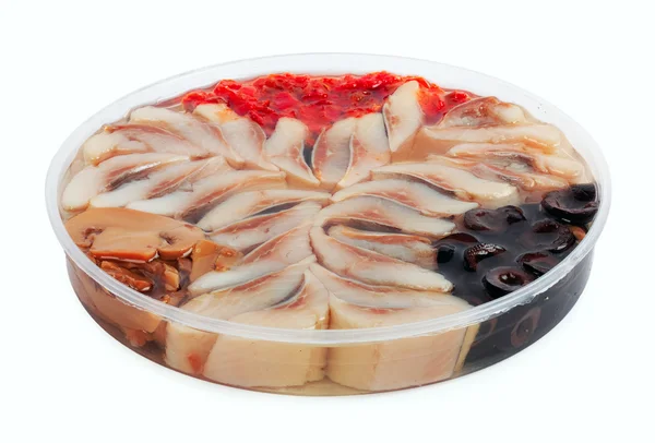 Slices of marinated herring with mushrooms and black olives — Stock Photo, Image