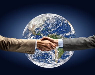 Handshake with map of the world in background clipart