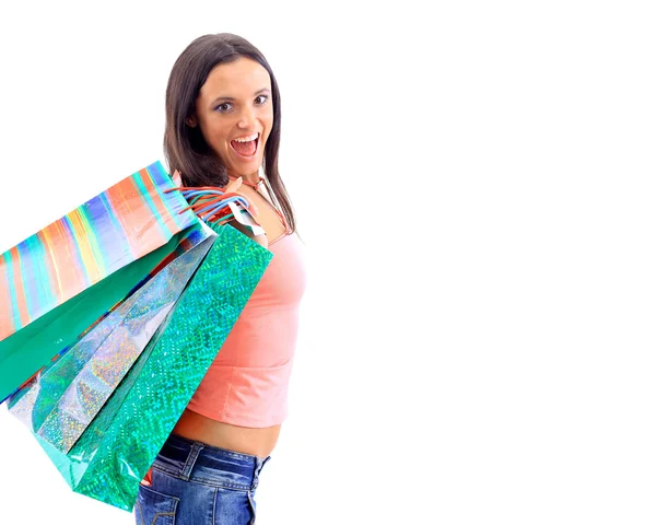 Porträtt av en ung kvinna som håller flera shoppingbag — Stockfoto