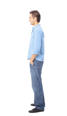 Young man standing with hands in pockets clipart