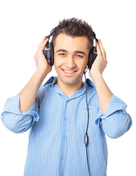 Jeune homme portant des écouteurs — Photo