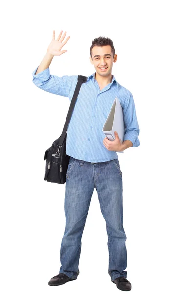 Młody człowiek stojący z rękami w kieszeniach — Zdjęcie stockowe