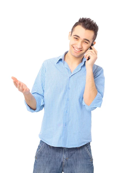 Usmíval se mladý muž, modrou košili, mluví na mobil — Stock fotografie