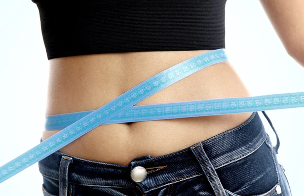Measure tape around slim beautiful waist. — Stock Photo, Image