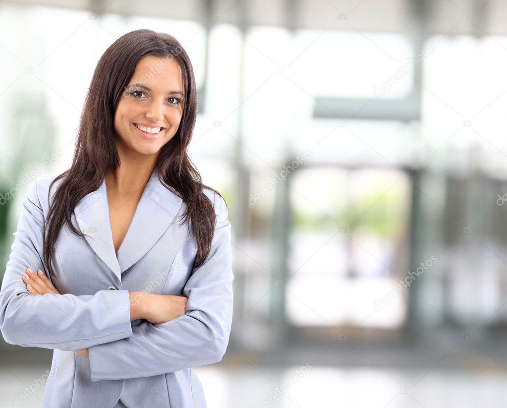 A portrait of a young business woman in an office Stock Photo by