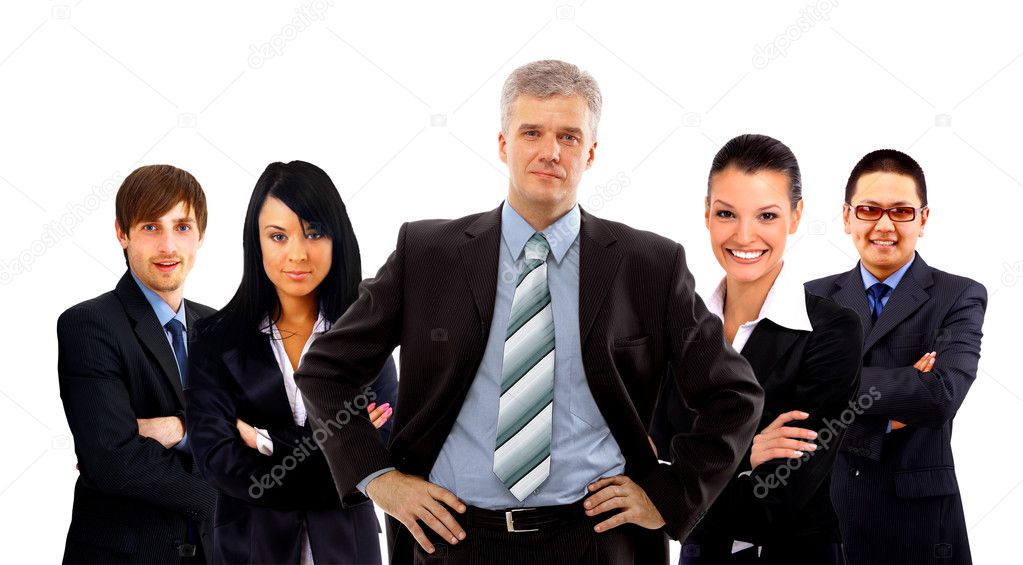 Confident young business executive with his team in the background