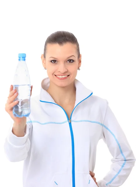 Frau in Sportkleidung trinkt Wasser, isoliert auf weiß — Stockfoto
