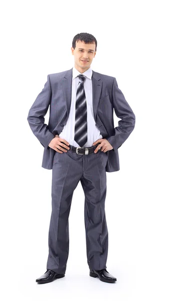 Volledige lengte van een knappe zakenman met handen gevouwen tegen witte rug — Stockfoto