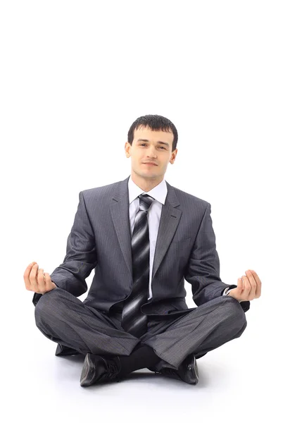 Foto de un hombre de negocios relajado meditando sobre fondo blanco — Foto de Stock