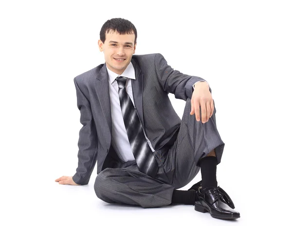 Portréja egy alkalmi fiatal elégedett ember ül nyugodt. elszigetelt fehér — Stock Fotó