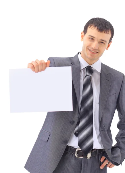 Молодий бізнесмен, що показує вивіску, ізольований на білому тлі — стокове фото