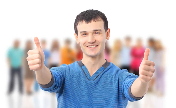 幸せなカジュアルな若い男親指を示すと笑みを浮かべて白い背景に隠れての分離 — ストック写真