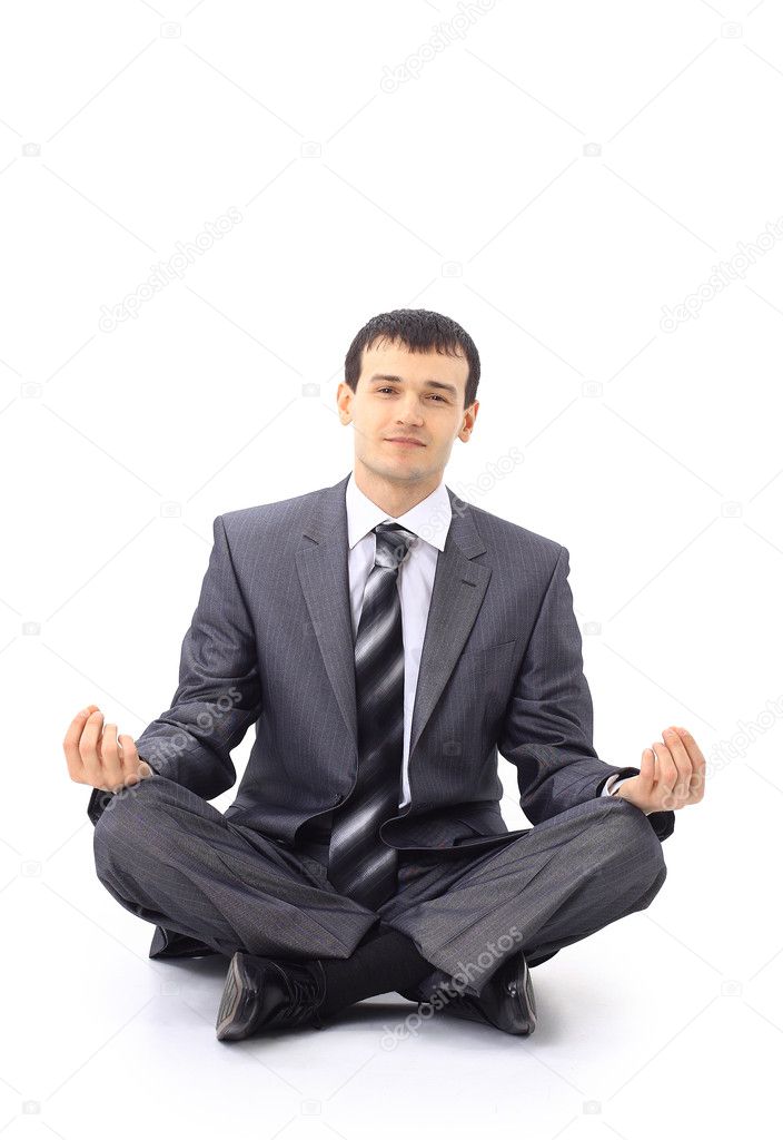 Photo of relaxed businessman meditating over white background
