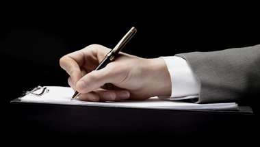 Businessman's hand with pen clipart