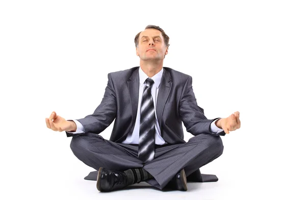 Relaxed businessman meditating isolated on white — Stock Photo, Image