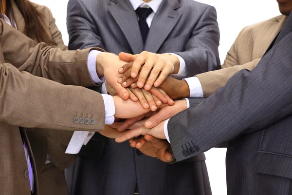 Close-up van het bedrijfsleven met hun handen samen tegen een zwarte backgr — Stockfoto