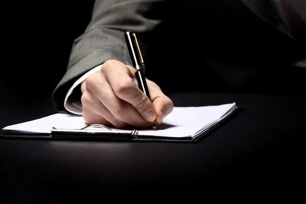 Mão de homem de negócios com caneta — Fotografia de Stock