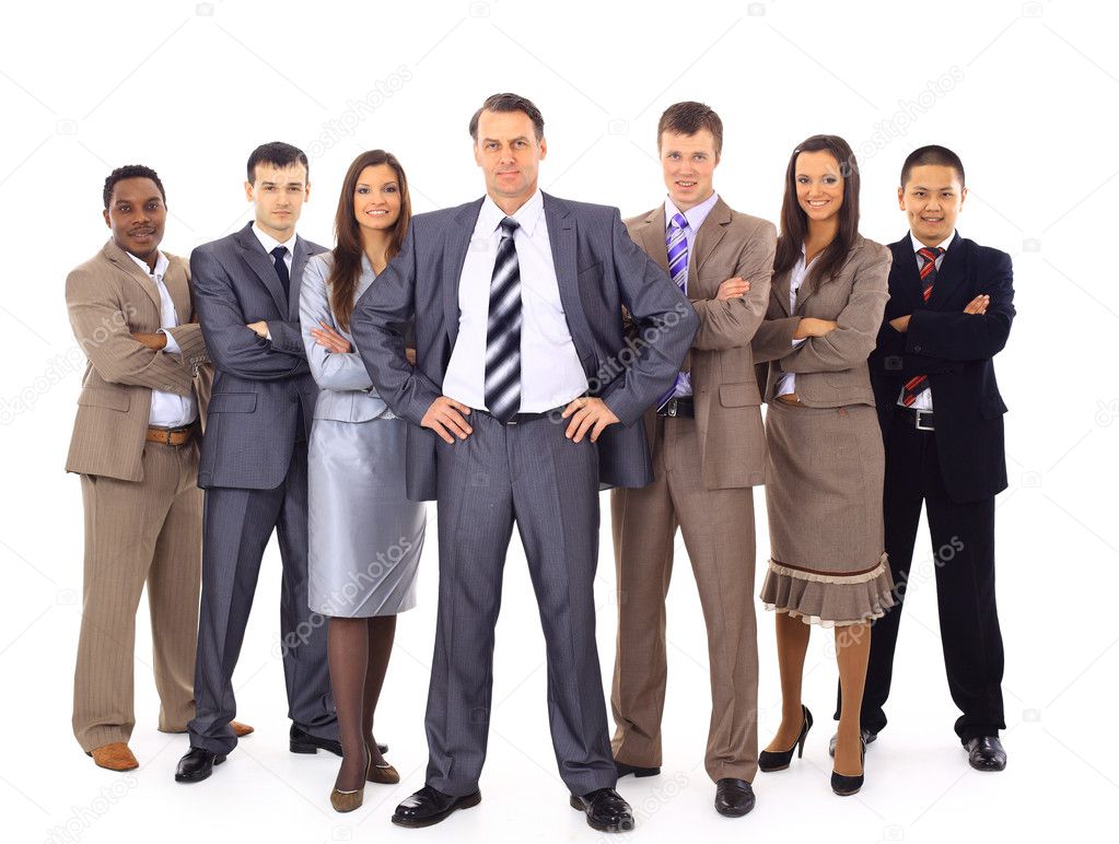 Confident business executive with his team in the background