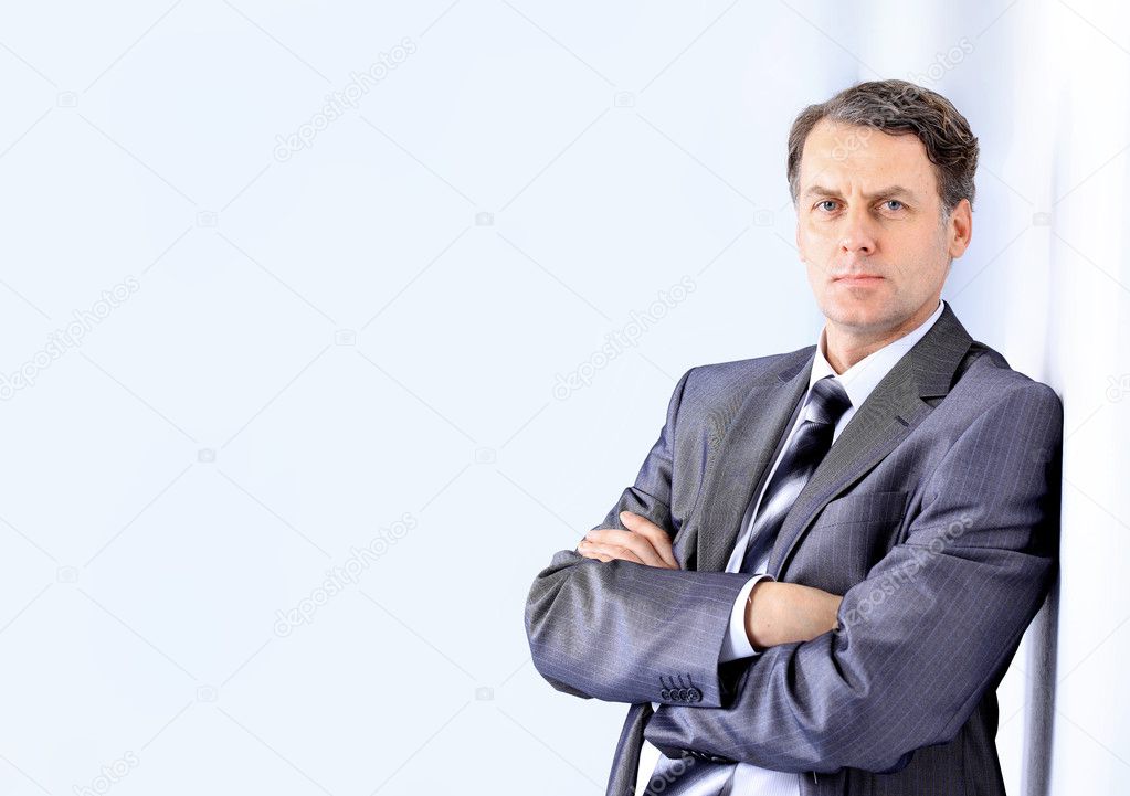Portrait of a handsome young man in a business suit