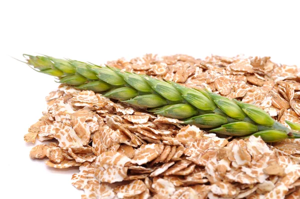 Пшеничні пластівці і вухо пшениці — стокове фото